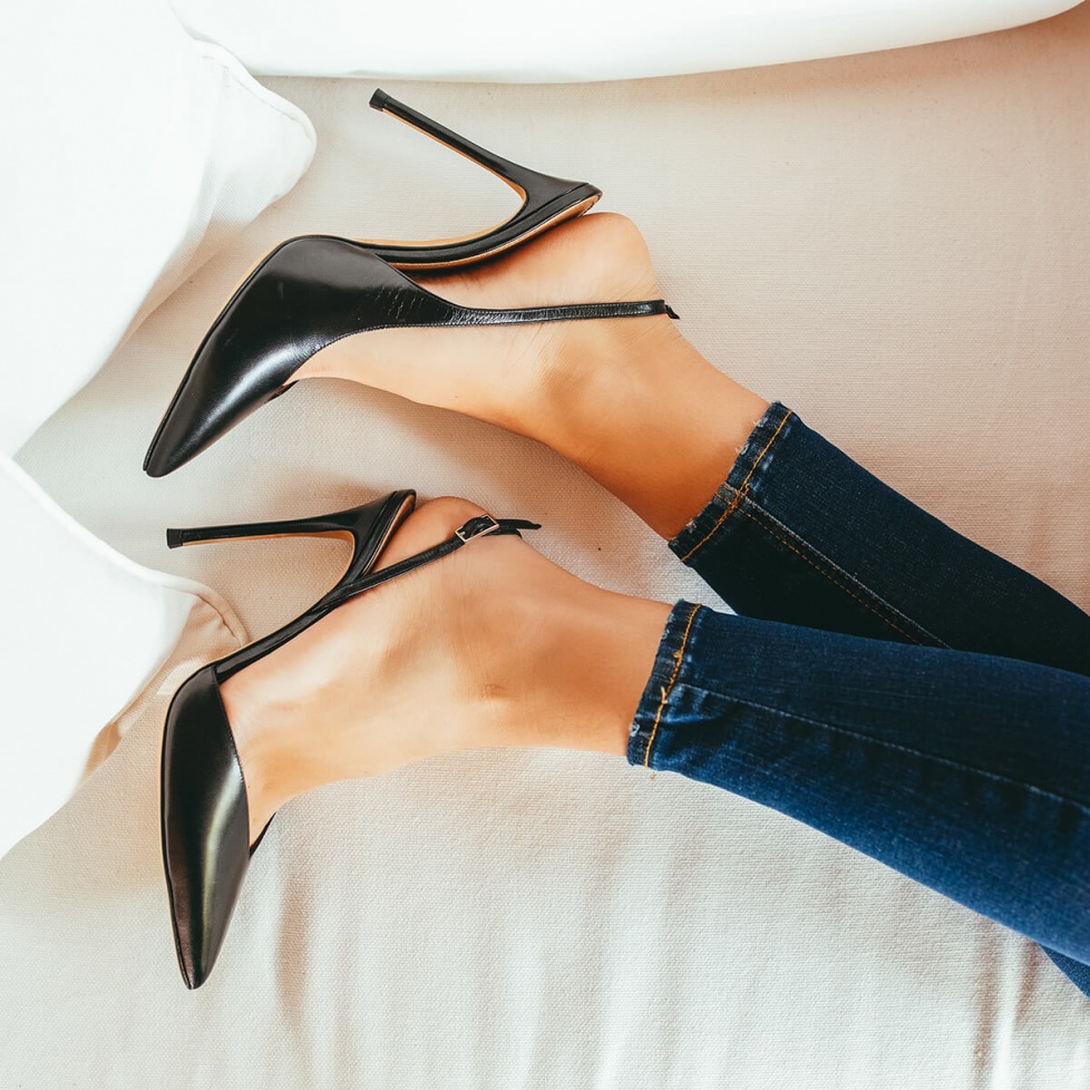 Black leather asymmetric heeled slingback pumps