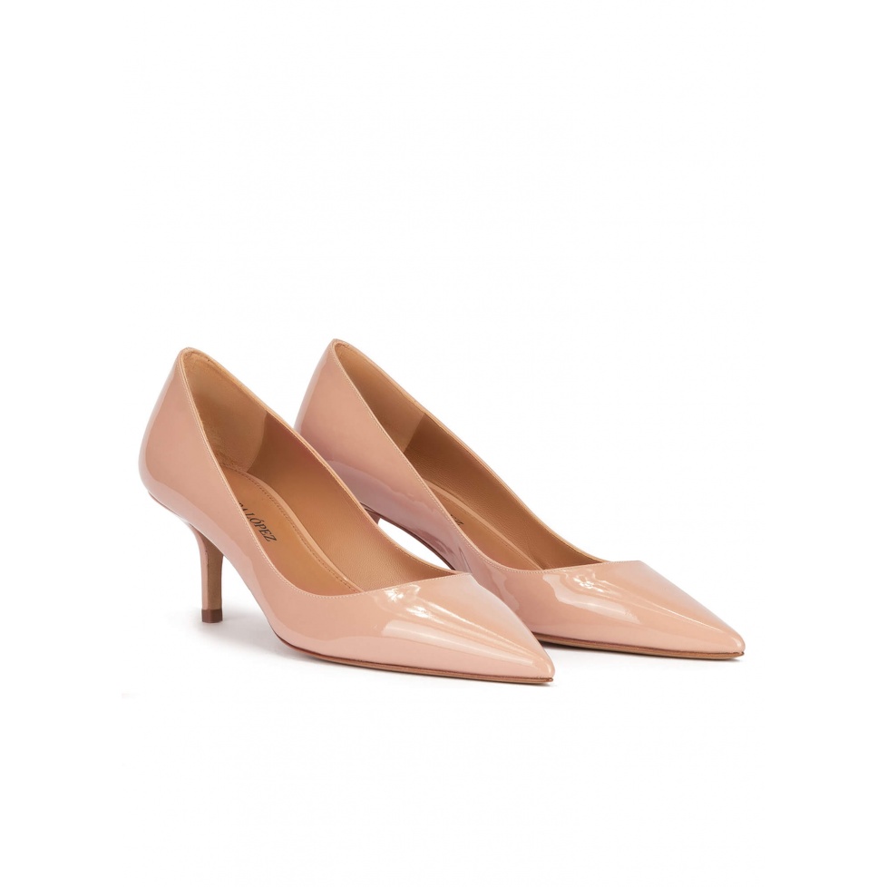 Mid heel pointy toe pumps in nude patent leather